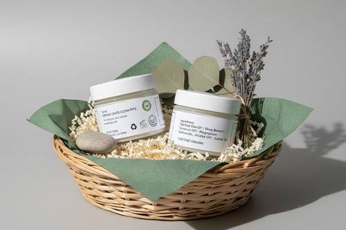 Two jars of deodorant in a gift basket